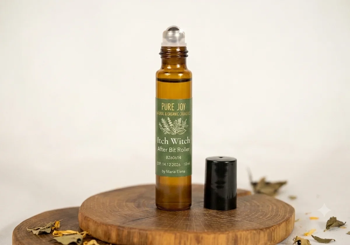 A 10ml amber glass roller bottle branded as Itch Witch by Maria Elena, set on a rustic wooden slice with scattered dried botanical leaves.